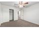 Bedroom with carpet, ceiling fan, and closet at 840 E Agua Fria Ln, Avondale, AZ 85323