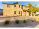 Two story home featuring a covered entryway, easy care landscaping, and a charming front yard at 840 E Agua Fria Ln, Avondale, AZ 85323