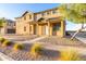 Inviting home with a covered entryway and desert landscaping for easy upkeep at 840 E Agua Fria Ln, Avondale, AZ 85323