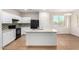 Bright kitchen with white cabinets, granite countertops, and stainless steel appliances at 840 E Agua Fria Ln, Avondale, AZ 85323