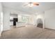 Open-concept living room with kitchen access and staircase to the second floor at 840 E Agua Fria Ln, Avondale, AZ 85323