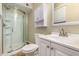 Bathroom with walk-in shower, white vanity, and ample natural light at 915 E Commonwealth Pl, Chandler, AZ 85225
