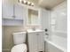 Bathroom with a vanity, mirror, and shower-tub combination offering functionality at 915 E Commonwealth Pl, Chandler, AZ 85225