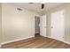 A bedroom with hardwood floors and neutral walls, offering a blank canvas for personalization at 915 E Commonwealth Pl, Chandler, AZ 85225