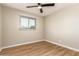 Bedroom featuring a fan and window, providing natural light and a comfortable atmosphere at 915 E Commonwealth Pl, Chandler, AZ 85225