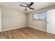 Bedroom featuring wood-look floors and neutral-colored brick wall at 915 E Commonwealth Pl, Chandler, AZ 85225