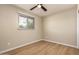 Bedroom showcasing wood-look floors and a window for natural light at 915 E Commonwealth Pl, Chandler, AZ 85225