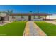Charming single-story home featuring a well-manicured front yard with a paved walkway at 915 E Commonwealth Pl, Chandler, AZ 85225