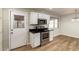 Kitchen showing stainless steel oven and microwave, and door to exterior at 915 E Commonwealth Pl, Chandler, AZ 85225