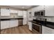 Updated kitchen featuring stainless steel appliances and granite countertops at 915 E Commonwealth Pl, Chandler, AZ 85225