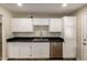 Bright kitchen featuring white cabinets, black countertops, and stainless steel appliances at 915 E Commonwealth Pl, Chandler, AZ 85225