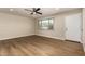 Bright living room featuring ceiling fan, neutral walls, and wood-look floors at 915 E Commonwealth Pl, Chandler, AZ 85225