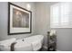 Elegant bathroom featuring a standalone tub, pendant lighting, and a decorative shelving unit at 943 E Kortsen Rd # 10, Casa Grande, AZ 85122