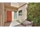 Charming front entrance with a cozy seating area and lush landscaping at 943 E Kortsen Rd # 10, Casa Grande, AZ 85122