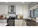 A kitchen featuring white cabinets, subway tile backsplash, stainless steel appliances, and concrete countertops at 943 E Kortsen Rd # 10, Casa Grande, AZ 85122