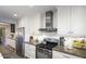 Bright kitchen featuring stainless steel appliances, white cabinets, and a tile backsplash at 943 E Kortsen Rd # 10, Casa Grande, AZ 85122