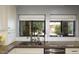 The kitchen boasts a stainless steel sink and windows providing a view of the home's exterior and landscaping at 943 E Kortsen Rd # 10, Casa Grande, AZ 85122