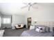Spacious main bedroom with plush carpeting, and an ensuite bathroom visible through the doorway at 943 E Kortsen Rd # 10, Casa Grande, AZ 85122
