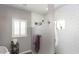 Modern bathroom with white subway tile in the shower area and natural light from the window at 943 E Kortsen Rd # 10, Casa Grande, AZ 85122