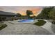 Beautiful backyard pool with lush landscaping and hardscape provides the perfect spot for relaxing and entertaining at 9805 W Caron Dr, Peoria, AZ 85345