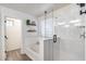 Bright bathroom featuring subway tile wall, shower, bathtub, and decorative shelving at 9805 W Caron Dr, Peoria, AZ 85345