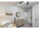 Cozy bedroom featuring neutral paint, dresser, round mirror, and grey carpet at 9805 W Caron Dr, Peoria, AZ 85345