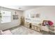 bedroom area with soft pink accents, toy storage and a patterned rug at 9805 W Caron Dr, Peoria, AZ 85345