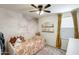 Cozy bedroom showcasing stylish wallpaper, a unique bedframe, and warm, inviting decor at 9805 W Caron Dr, Peoria, AZ 85345