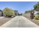 Long driveway leads to a two-story home featuring desert landscaping and an attached two-car garage at 9805 W Caron Dr, Peoria, AZ 85345