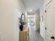 Inviting hallway with neutral walls, hard surface floors, and tasteful decor at 9805 W Caron Dr, Peoria, AZ 85345