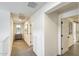 Bright hallway leading to various rooms, offering a seamless transition between spaces in the home at 9805 W Caron Dr, Peoria, AZ 85345