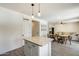 Open-concept kitchen adjacent to a dining area and living space for easy entertaining at 9805 W Caron Dr, Peoria, AZ 85345