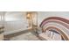 Cozy loft area with neutral tones, carpeted floor, and decorative rainbow wall art, creating a relaxing and inviting space at 9805 W Caron Dr, Peoria, AZ 85345
