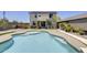 A pristine pool is surrounded by well-kept landscaping and a charming two-story home at 9805 W Caron Dr, Peoria, AZ 85345