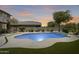 An inviting backyard pool features cool, refreshing water and ample patio space for lounging and entertaining at 9805 W Caron Dr, Peoria, AZ 85345