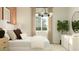 Comfortable bedroom with a large bed, soft lighting, and a decorative light fixture at 9830 W Pinchot Ave, Phoenix, AZ 85037