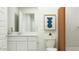 A modern bathroom featuring neutral paint, a white countertop and cabinets, and stylish decorations at 9839 W Pinchot Ave, Phoenix, AZ 85037