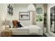 A bedroom featuring modern skate-themed wall decor, neutral paint scheme, and natural lighting at 9839 W Pinchot Ave, Phoenix, AZ 85037
