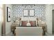A bedroom featuring a bed with a white headboard, stylish lighting, and modern blue lightning-bolt wallpaper at 9839 W Pinchot Ave, Phoenix, AZ 85037