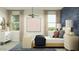 Bright bedroom featuring natural light, chic lighting fixture, and stylish red-dotted abstract artwork at 9839 W Pinchot Ave, Phoenix, AZ 85037
