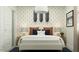 A bedroom featuring modern skate-themed wall decor, neutral paint scheme, and modern lighting fixture at 9839 W Pinchot Ave, Phoenix, AZ 85037