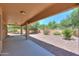 Extended covered patio provides an inviting space to enjoy the private and low maintenance backyard at 103 S Birdie Way, Casa Grande, AZ 85194