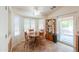 Sun-filled breakfast nook features wood furniture, tile floors, and large windows at 103 S Birdie Way, Casa Grande, AZ 85194