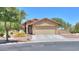 Charming single-story home featuring a xeriscaped front yard and a spacious two-car garage at 103 S Birdie Way, Casa Grande, AZ 85194