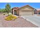 Attractive single-story home featuring desert landscaping and a two-car garage at 103 S Birdie Way, Casa Grande, AZ 85194