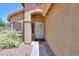 Inviting front porch with charming desert landscaping and a secure screen door at 103 S Birdie Way, Casa Grande, AZ 85194