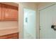 Bright hallway with built in cabinet space and access to garage at 103 S Birdie Way, Casa Grande, AZ 85194