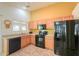 Functional kitchen featuring stainless steel appliances, tile flooring, and natural light at 103 S Birdie Way, Casa Grande, AZ 85194