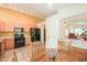 Bright kitchen features matching appliances, tan countertops, tile floors, and a breakfast nook at 103 S Birdie Way, Casa Grande, AZ 85194