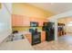 Bright kitchen features matching appliances, tan countertops, and tile floors at 103 S Birdie Way, Casa Grande, AZ 85194